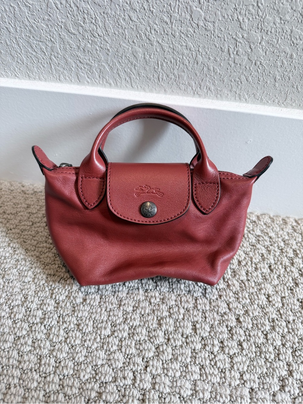 Longchamp small leather top-handle bag in deep red